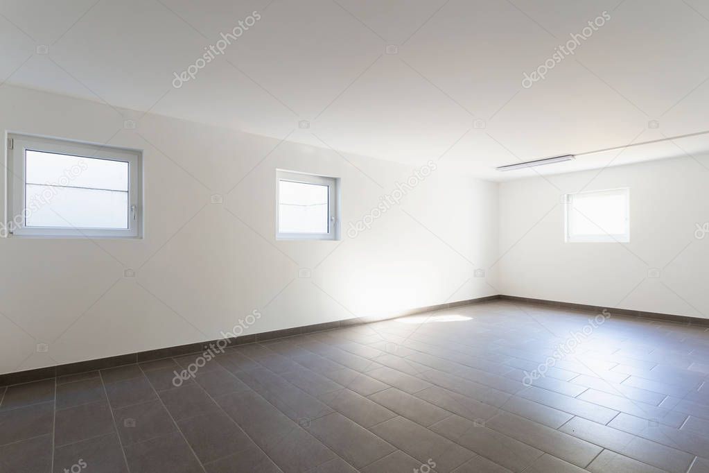 Cellar with gray tiles and white walls