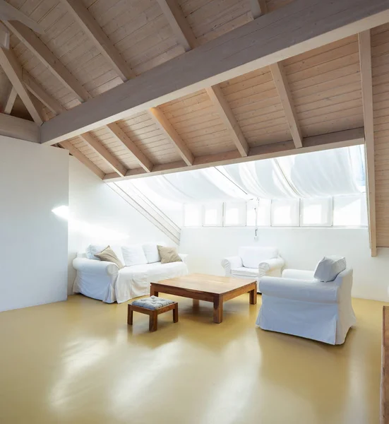 Attic with couch and armchair — Stock Photo, Image