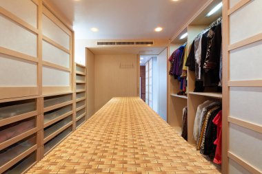 Giant walk-in closet with drawers clipart