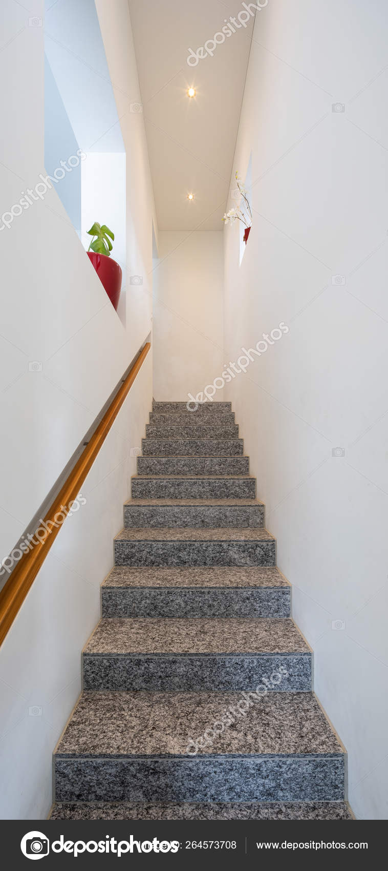 Marble Stairs With Wooden Handrails And Spotlights In The