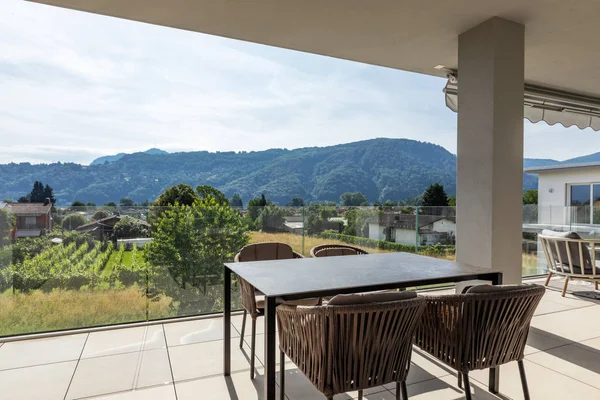 Balcony with outdoor furniture in luxury house