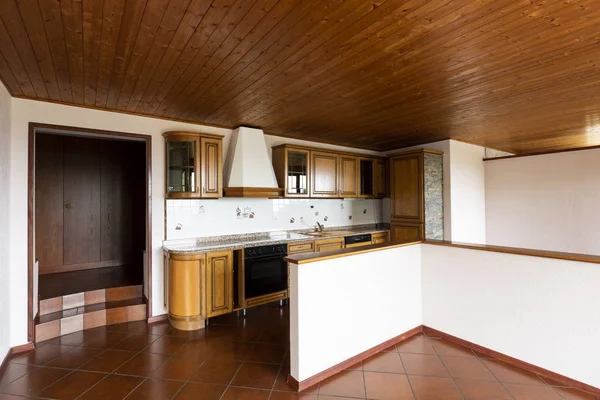 Traditional kitchen with terracotta and wood on the ceiling.