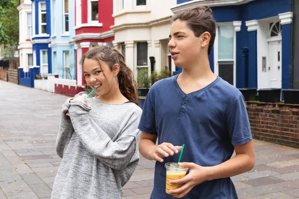 Couple of teenagers with shake in hand — Stock Photo, Image