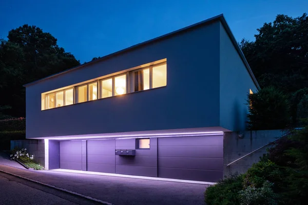 House exterior with purple lighting. Night image — Stock Photo, Image