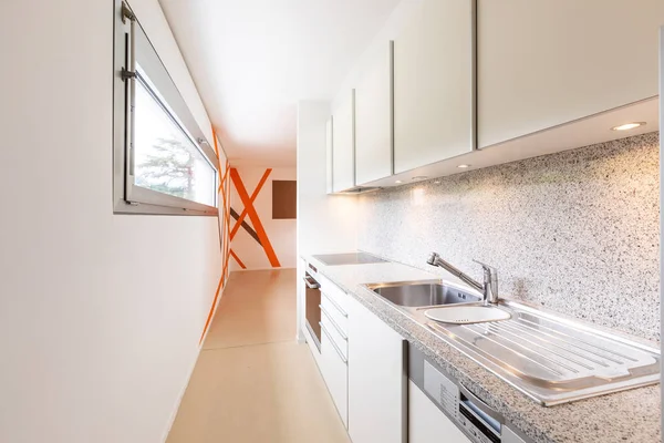 Modern kitchen with spotlights in the designer apartment