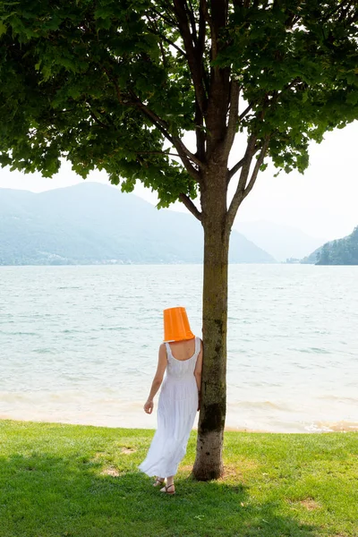 Young Woman Standing Lake Orange Bucket Her Head Long Dress — Stock Photo, Image