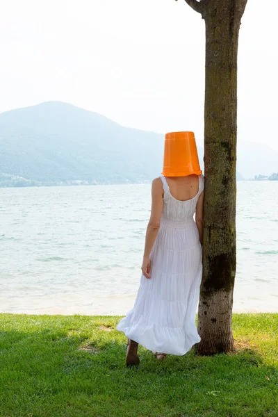 Young Woman Standing Lake Orange Bucket Her Head Long Dress — Stock Photo, Image