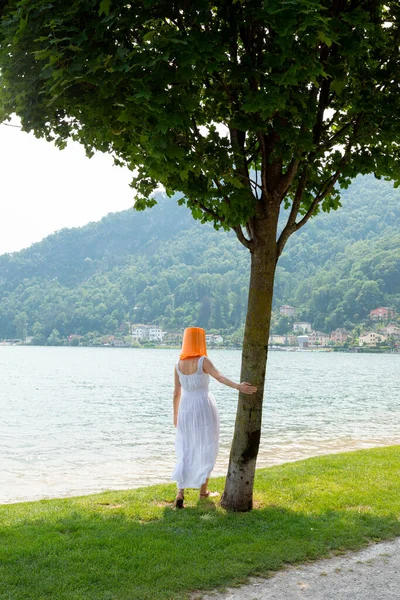 Young Woman Standing Lake Orange Bucket Her Head Long Dress — Stock Photo, Image