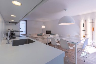 Beyaz atölyesi ve gri lavabosu olan modern bir mutfak. Büyük cam masa, özel tasarım sandalyeler, rahat deri koltuklar ve şarap şişeleri ve LED 'lerle dolu bir kitaplık. İçeride kimse yok.