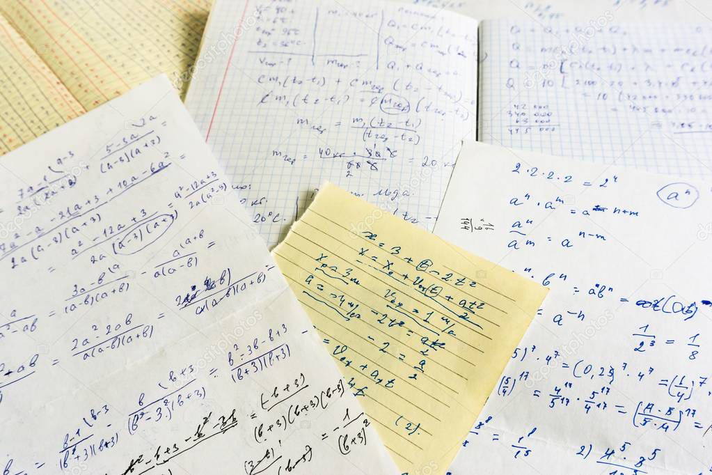 old sheets of paper with mathematical and physical calculations