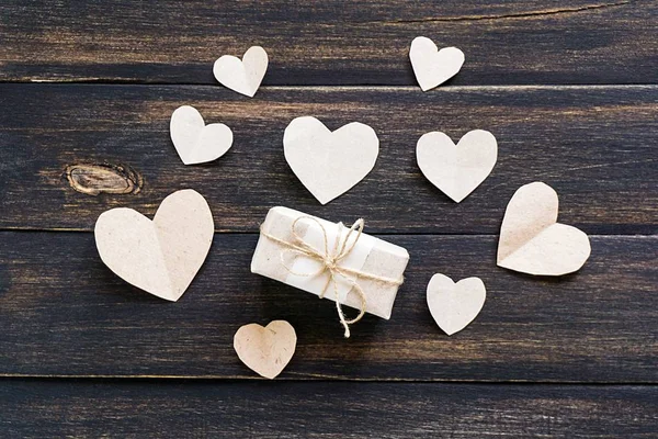 hearts and gift wrapped paper. Flat lay, top view, copy space.