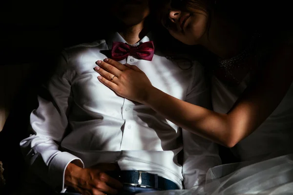 The groom and unfocused bride are on the sofa — Stock Photo, Image