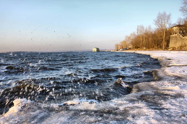 the winter landscape with a rocks and the sea