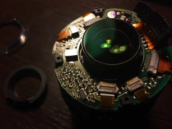 Lens inside macro of the back side of a circuit board — Stock Photo, Image