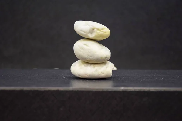 Balanced stones on table with copy space and blur background for creative idea concept