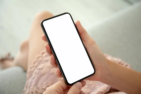 Female hands in pink dress holding phone with isolated screen — Stock Photo, Image