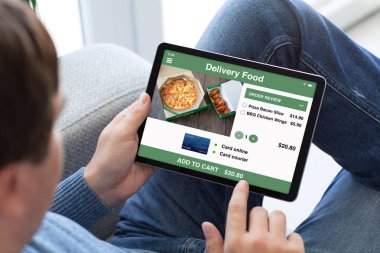 adam tablet bilgisayar app teslim gıda ile tutan kot pantolon