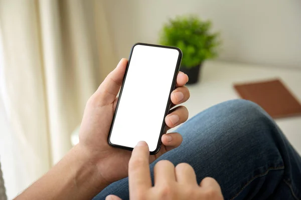 Man hands holding phone with isolated screen in the room — Stock Photo, Image