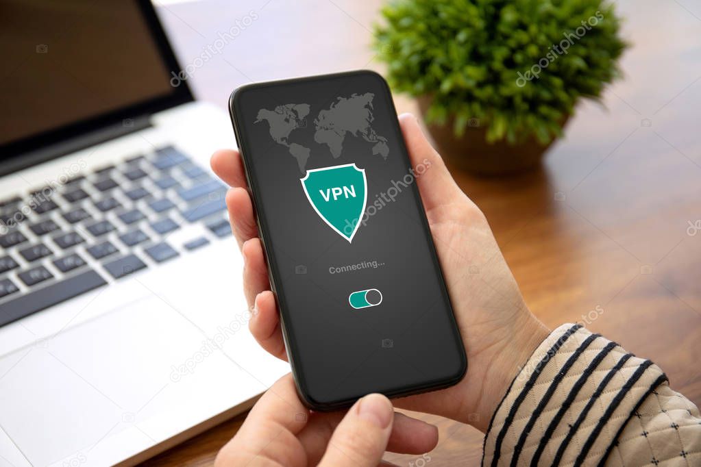 woman hands holding phone with app vpn private network