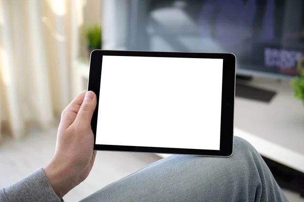 Man handen houden computer tablet met geïsoleerd scherm in de kamer — Stockfoto