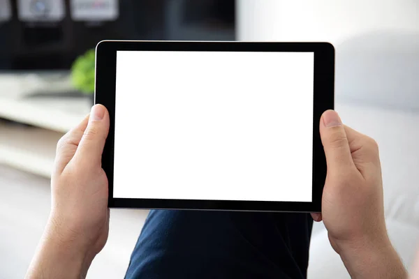 Man hands holding computer tablet with isolated screen in room — Stock Photo, Image