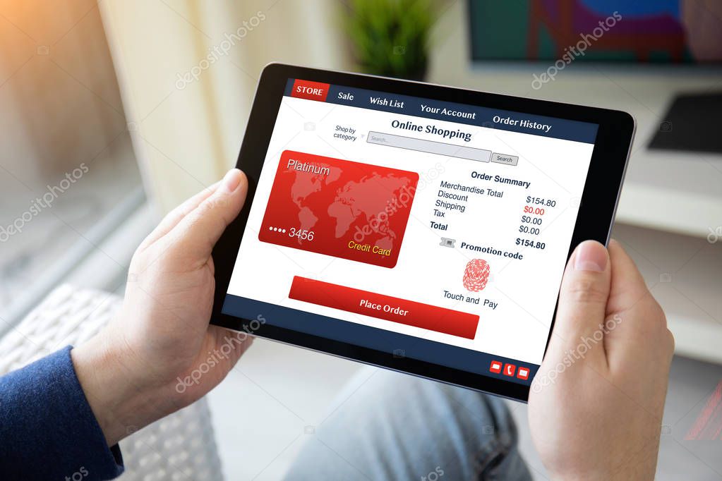 man hands holding computer tablet with app online shopping