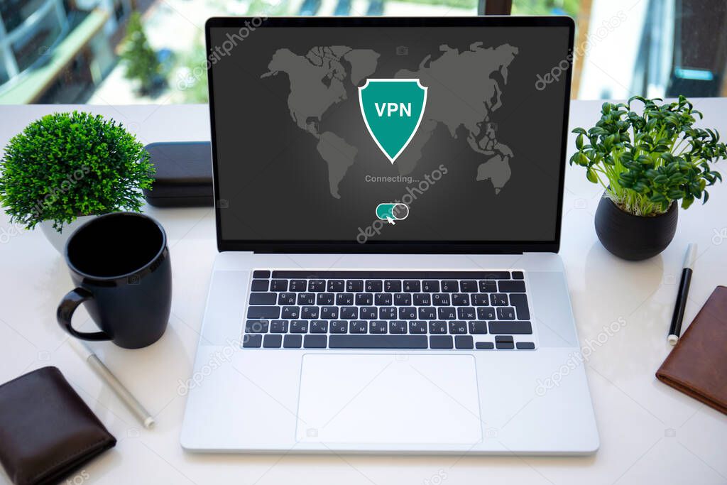 laptop with app vpn creation Internet protocols for protection private network on screen in the office