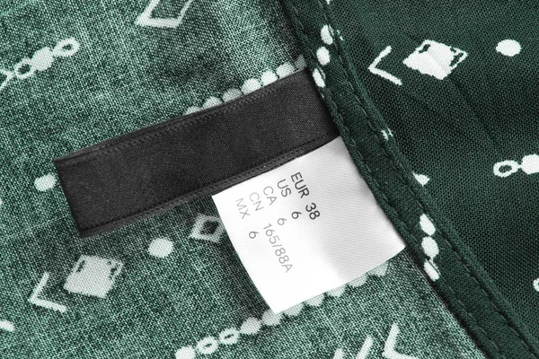 Etiqueta Ropa Textil Tamaños Primer Plano Fondo Algodón Verde — Foto de Stock