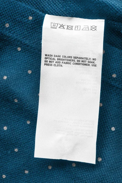 Mavi lekeli Tekstil arka plan closeup bakım kıyafet etikette