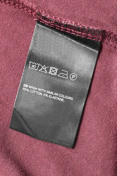 Догляд Композиція Етикетки Одягу Текстильному Фоні — стокове фото