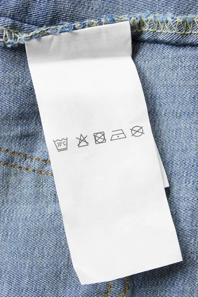 Mavi Kot Arka Plan Closeup Bakım Kıyafet Etikette — Stok fotoğraf