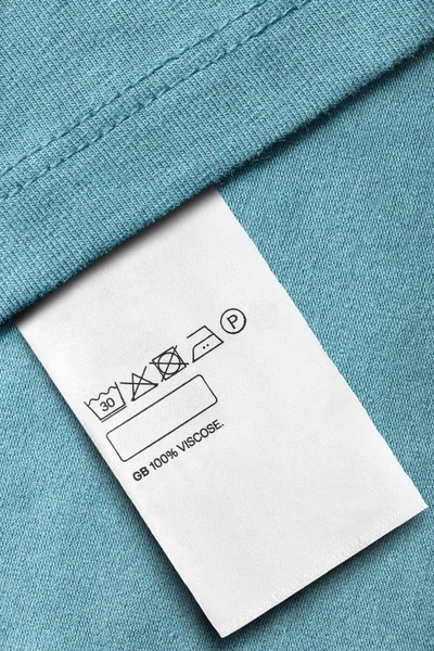 Pielęgnacja Skład Etykiecie Ubrania Niebieskim Tle Wiskoza Zbliżenie — Zdjęcie stockowe