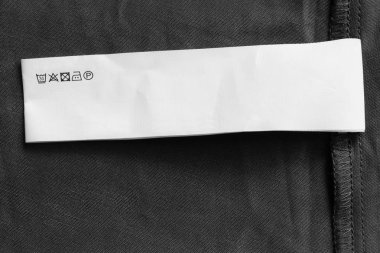 Bakım kıyafet etiket portre siyah tekstil zemin üzerine