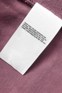 Pembe Tekstil arka plan closeup bakım kıyafet etikette