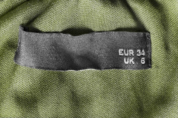 Tamanho Roupas Etiqueta Cáqui Verde Têxtil Fundo Closeup — Fotografia de Stock