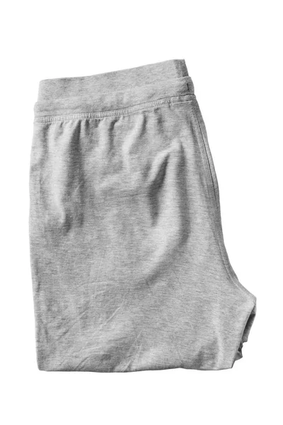 折叠的灰色体育基本的裤子隔绝白色 — 图库照片