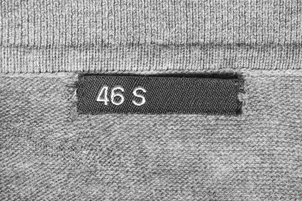 Size Clothes Label Grey Knitted Background — Stock Photo, Image