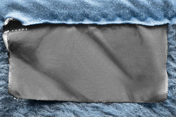 Etiqueta Roupas Têxteis Branco Fundo Têxtil Azul Close — Fotografia de Stock