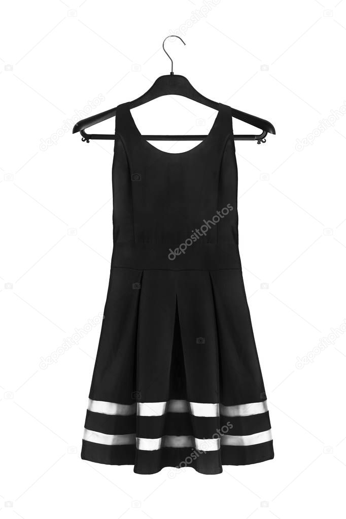Black mini pleated dress on black clothes rack isolated over white