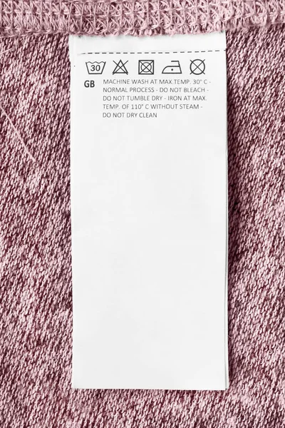 Cuidados Roupas Etiqueta Rosa Tricotado Fundo Closeup — Fotografia de Stock