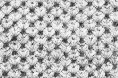 Beyaz bir arka plan olarak yün doku closeup örme