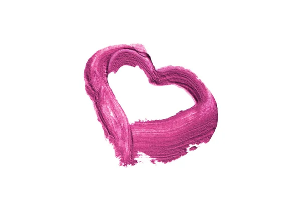 Vivid pink lipstick smear in the shape of a heart on white background