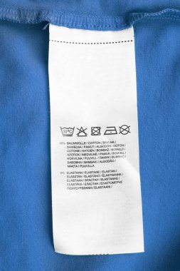 Pamuk ve farklı dillerde elastan bakım ve kompozisyon elbise etiket diyor