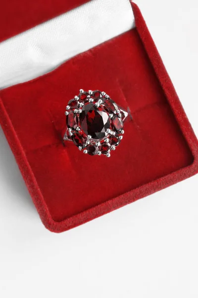 Luxury ruby ring in red jewel box closeup