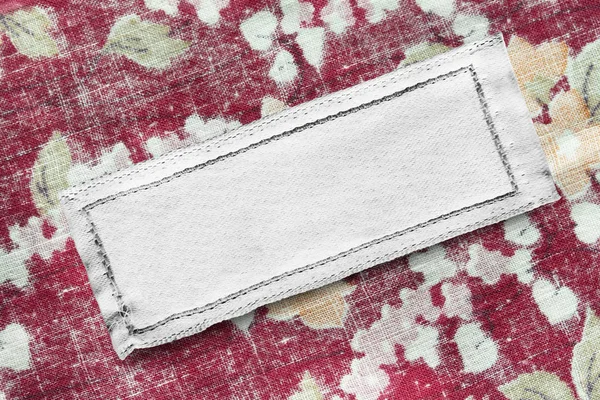 Bianco Bianco Bianco Vestiti Etichetta Sfondo Cotone Rosso Primo Piano — Foto Stock