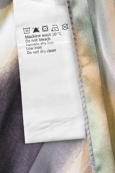 Care Clothes Label Colorful Satin Background Closeup — Stock Photo, Image