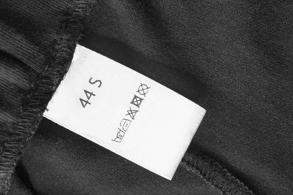 Zorg kleding label — Stockfoto