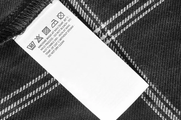 Zorg kleding label — Stockfoto