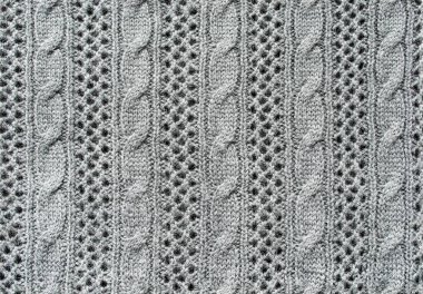 Göğüs kafesi gibi pürüzsüz gri yün örülmüş doku.