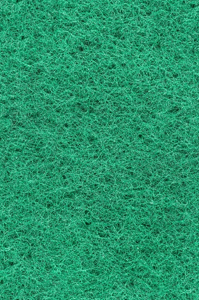 Seamless texture of green synthetic fiber closeup